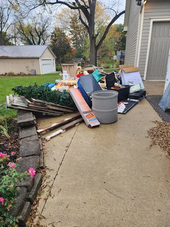 Dumpster being loaded with debris for 3 Yard Dumpster Rental in Wahpeton